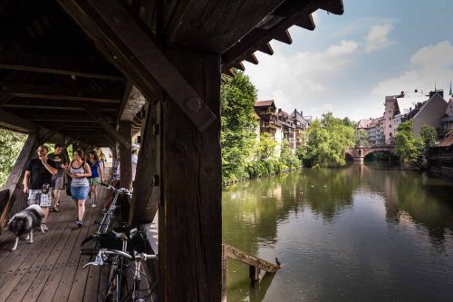 Nuremberg, Germany, June 2015.Henkersteg bridge at TrodelMArkt island.çNuremberg, a city in Bavaria, is distinguished by its medieval architecture, including the fortifications and stone towers of its Altstadt (Old Town).