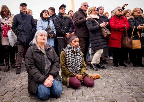 Vatican City, Rome, Italy; 28 feb 2013, People in S.Peter´s squeare sayng goodbye to Pope Benedict XVI. He left the Vatican by helicopter on Thursday afternoon to spend the final hours of his nearly eight-year, scandal-dogged papacy at the papal summer residence. Onlookers in St. Peter’s Square cheered, church bells rang and Romans stood on rooftops to wave flags as he flew from Rome to Castel Gandolfo, a hilltop town southeast of the city where popes have summered for centuries.