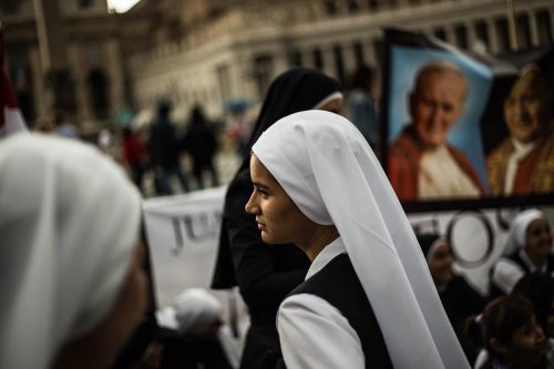 Rome, Italy, 27/4/2014.Two popes become saints in historic canonization ceremony.Pope Francis declared John Paul and John XXIII saints on Sunday morning, under grey skies, a crowd estimated at 250,000 in the Vatican’s St. Peter’s Square and streets nearby erupted in applause. Hundreds of polish flags were waved and some pilgrims wept with joy.