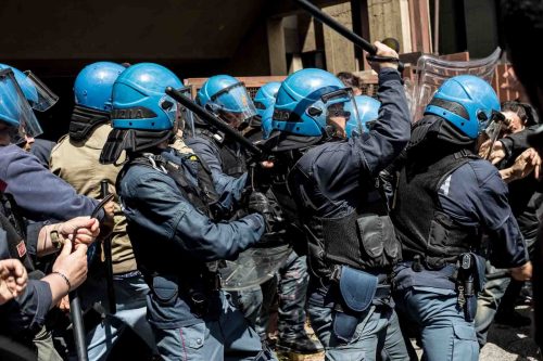 Rome, Italy, 16/4/2014.Several people have been injured in Rome as clashes erupted while Italian police evicted 350 squatter families caught up in the country's economic crisis. 350 families are locked on the roof of an occupied building.Riot police get ready to drag away some 350 squatter families from abandoned offices in Rome