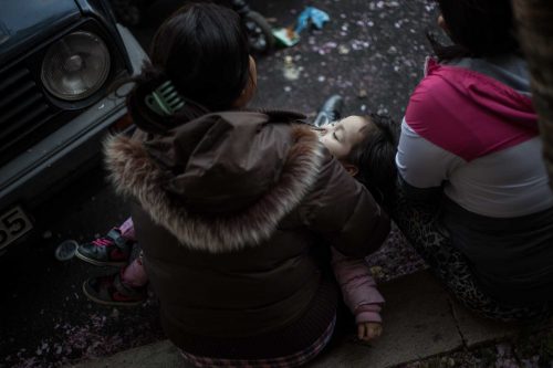 Rome, Italy, 16/4/2014.350 families are locked on the roof of an occupied building.Riot police get ready to drag away some 350 squatter families from abandoned offices in Rome